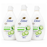 Three white bottles of Dove Refreshing Body Wash with cucumber graphics, arranged side by side on a white background.