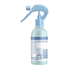 Light blue spray bottle with a white label on a white background