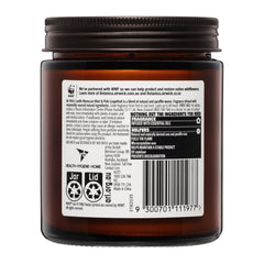 Back label of a brown jar with text and symbols on a white background