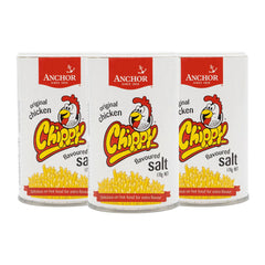 Three tins of Anchor Chippy Original Chicken Flavoured Salt on a white background