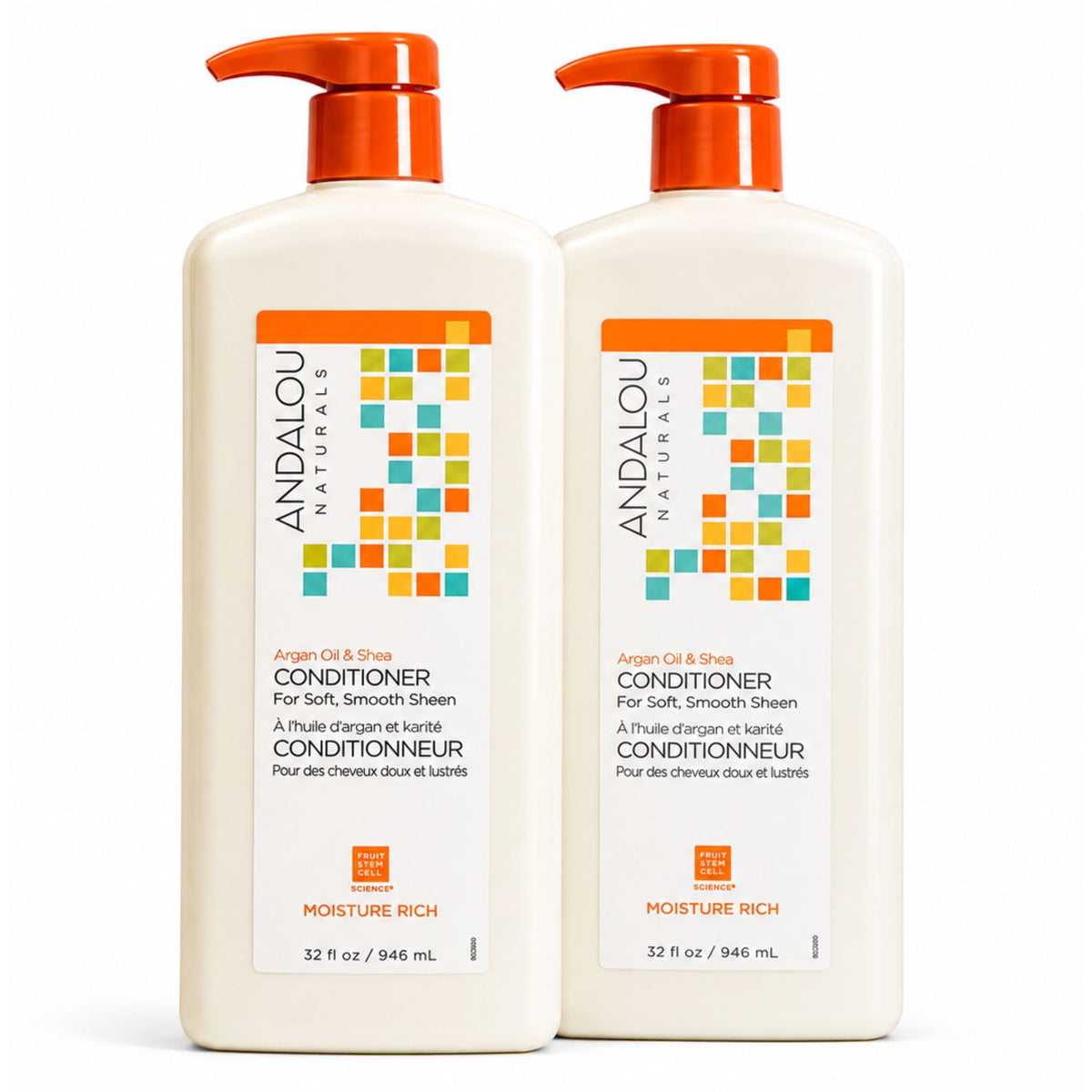 Two white pump bottles of Andalou Naturals Argan Oil & Shea Conditioner with orange caps, shown side by side on a white background.
