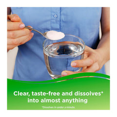 Person adding a white powder to a glass of water with a green banner at the bottom.
