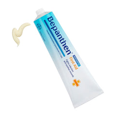 Bepanthen First Aid Cream 100g tube with cream dispensing from nozzle