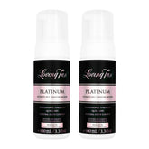 Two bottles of Loving Tan Platinum Ultimate Self-Tanning Mousse on a white background