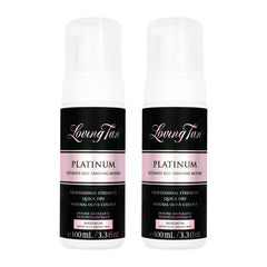 Two bottles of Loving Tan Platinum Ultimate Self-Tanning Mousse on a white background