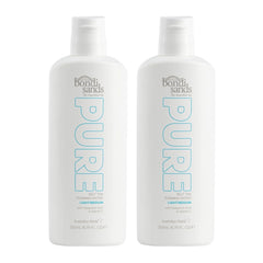 Two bottles of bondi sands Pure self-tan lotion on a white background