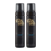 Two black bottles of Bondi Sands Ultra Dark tanning lotion on a white background