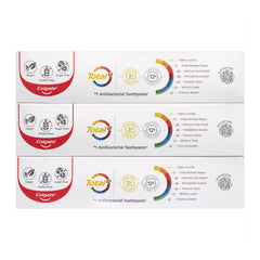 Multiple boxes of Colgate Total antibacterial toothpaste on a white background