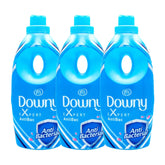 Three bottles of Downy Expert AntiBac fabric softener on a white background