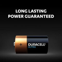Duracell battery with 'Long Lasting Power Guaranteed' text on a black background