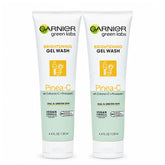 Two bottles of Garnier Green Labs Brightening Gel Wash with Pinea-C on a white background