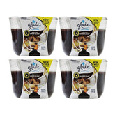 Four Glade 3-wick candles in elegant amber and sodal flavor packaging on a white background.