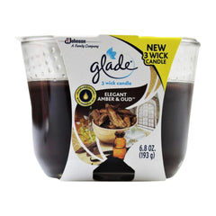 Glade candle packaging with 'Elegant Amber & Oud' scent on a white background