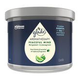Glade Aromatherapy Peaceful Mind candle with blue label and silver lid on a white background