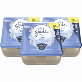 Three containers of Glade Clean Linen scented gel on a white background