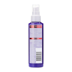Purple spray bottle with a label on a white background
