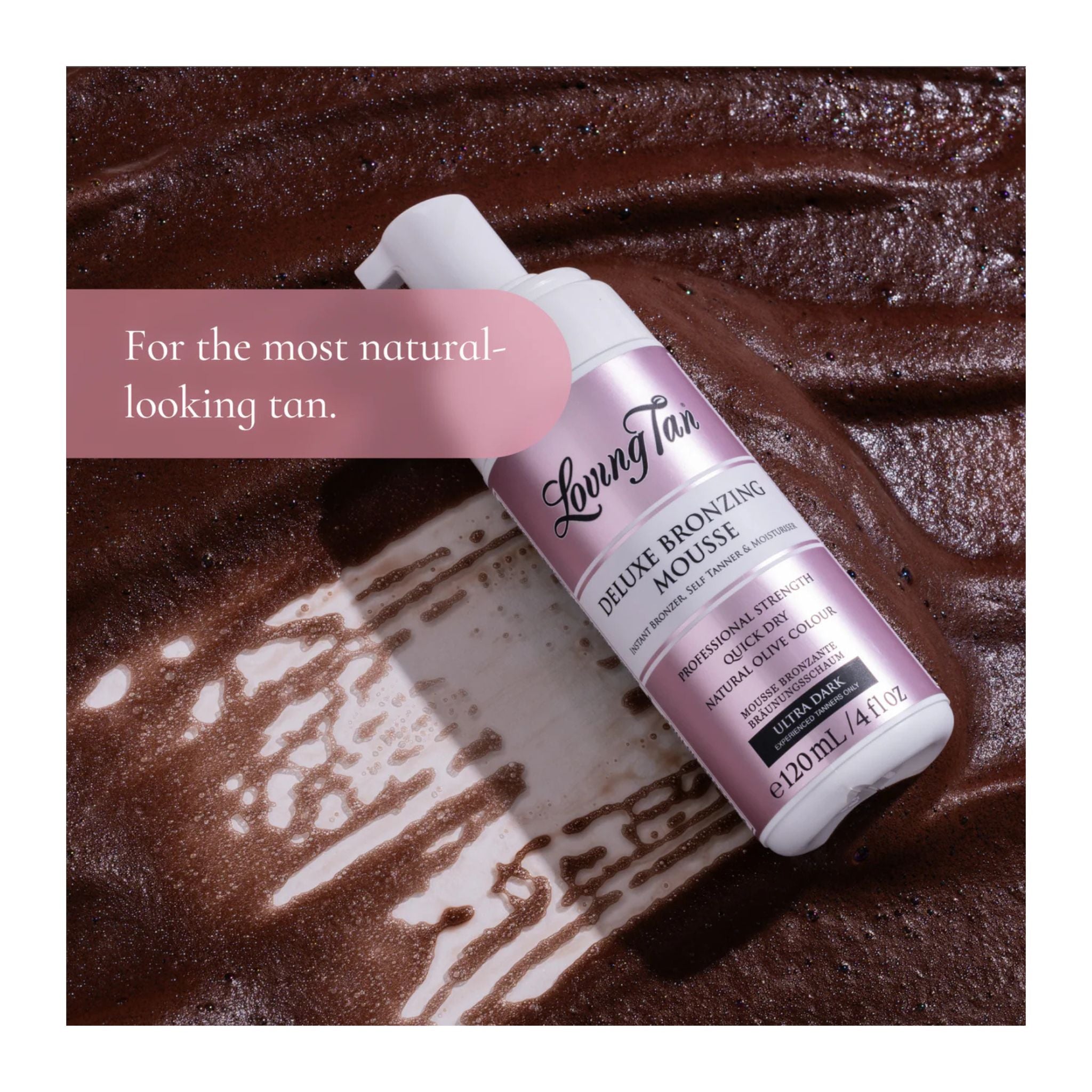 Living Tan Deluxe Bronzing Mousse bottle on a brown background with text 'For the most natural-looking tan.'