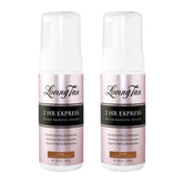 Two bottles of Loving Tan 2 HR Express Deluxe Bronzing Mousse on a white background