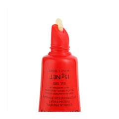 Red lip gloss tube with applicator on a white background