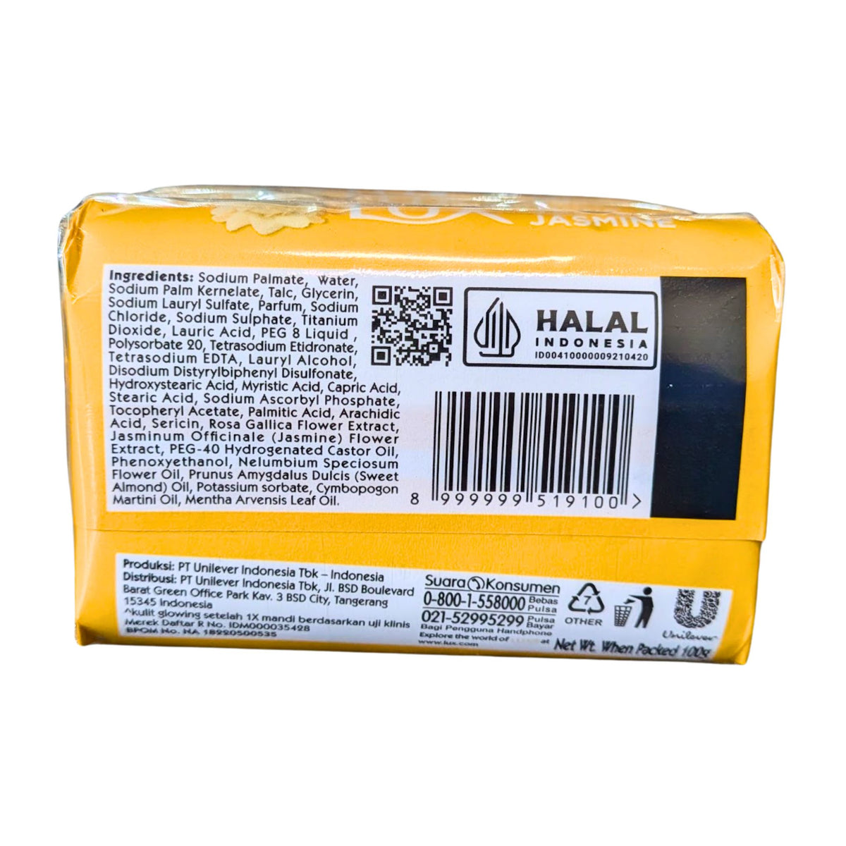Back view of a yellow soap bar with text and logos on a white background