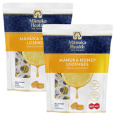 Two packages of Manuka Health MGO 400+ Manuka Honey Drops with Lemon, each package contains 250g of lozenges.