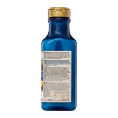 Green bottle with gold cap on a white background