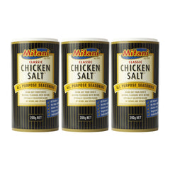 Three cans of Mitani Classic Chicken Salt seasoning on a white background