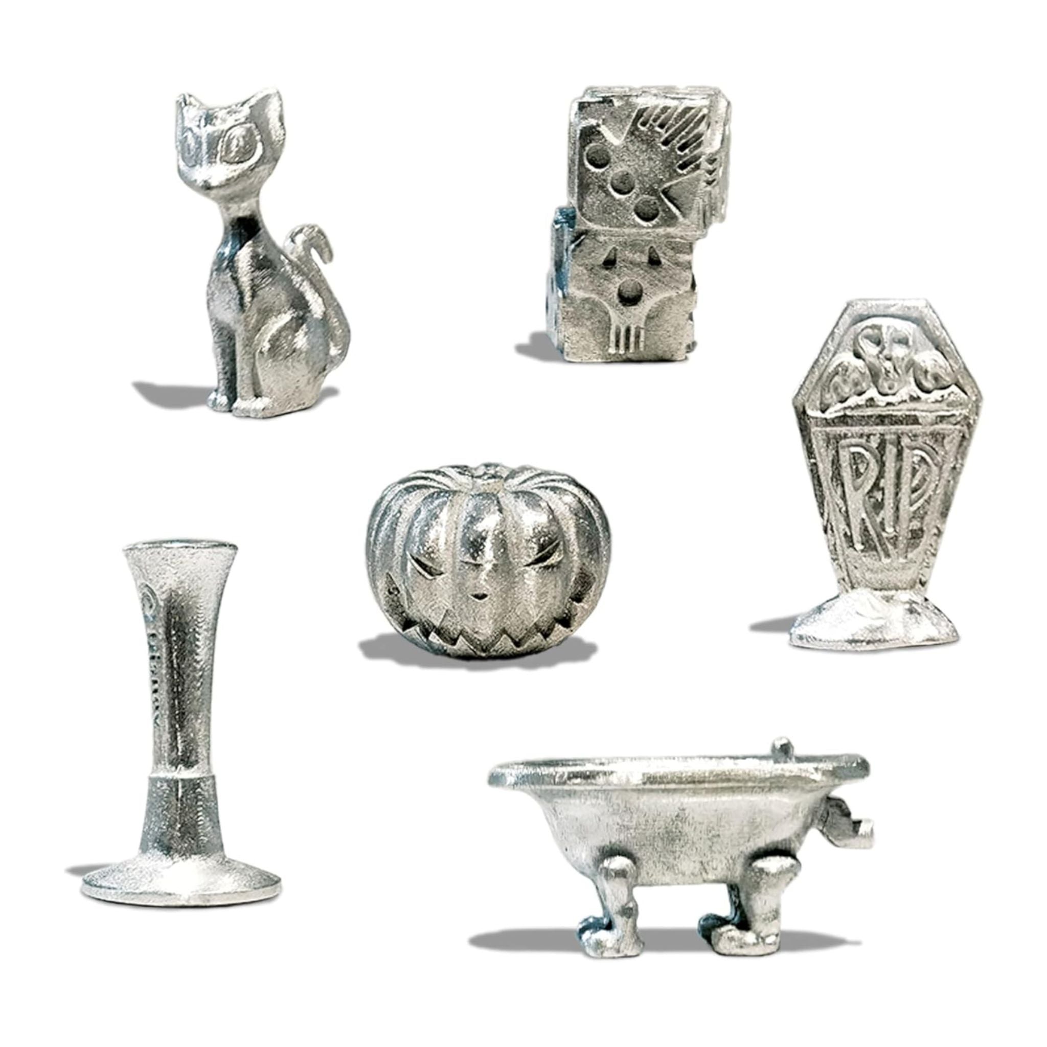 Set of silver Halloween-themed figurines on a white background