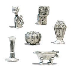 Set of silver Halloween-themed figurines on a white background