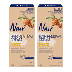 Two boxes of Nair hair removal cream with almond oil on a white background