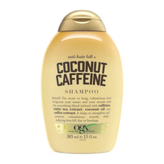 Shampoo bottle labeled 'Coconut Caffeine' on a white background