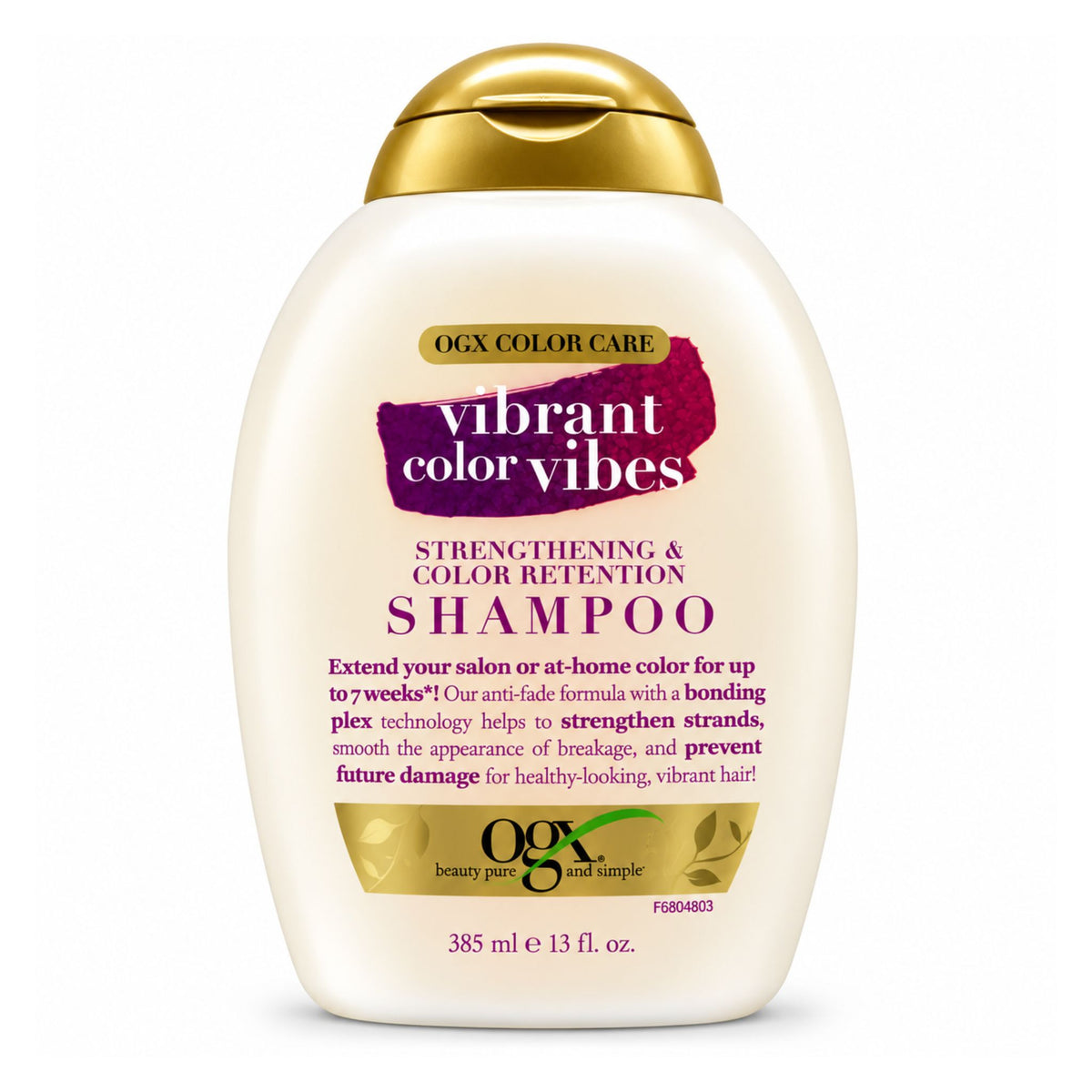 A bottle of OGX Color Care Vibrant Color Vibes Strengthening & Color Retention Shampoo, featuring an off-white bottle with a metallic gold cap and gold and purple label accents, set against a plain white background.