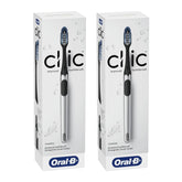 Two boxes of Oral-B Clic manual toothbrushes on a white background