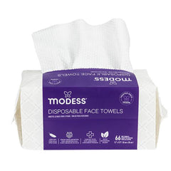 Side profile of Modess Disposable Face Towels pack displaying thickness and towel count