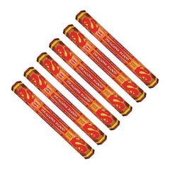 Set of incense sticks with red and yellow packaging on a white background