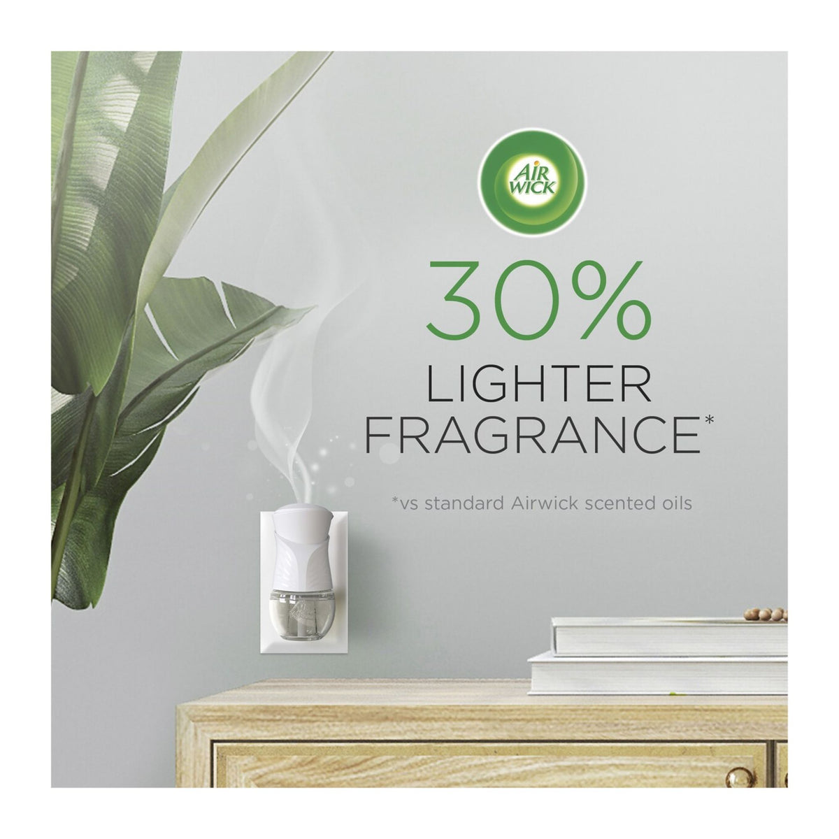 Air Wick diffuser on a wall with a plant and books in the background, highlighting 30% lighter fragrance.