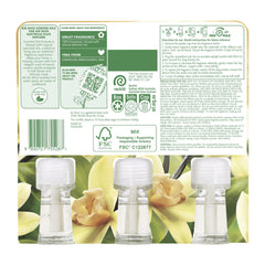 Product packaging with three clear bottles and floral design on a label.