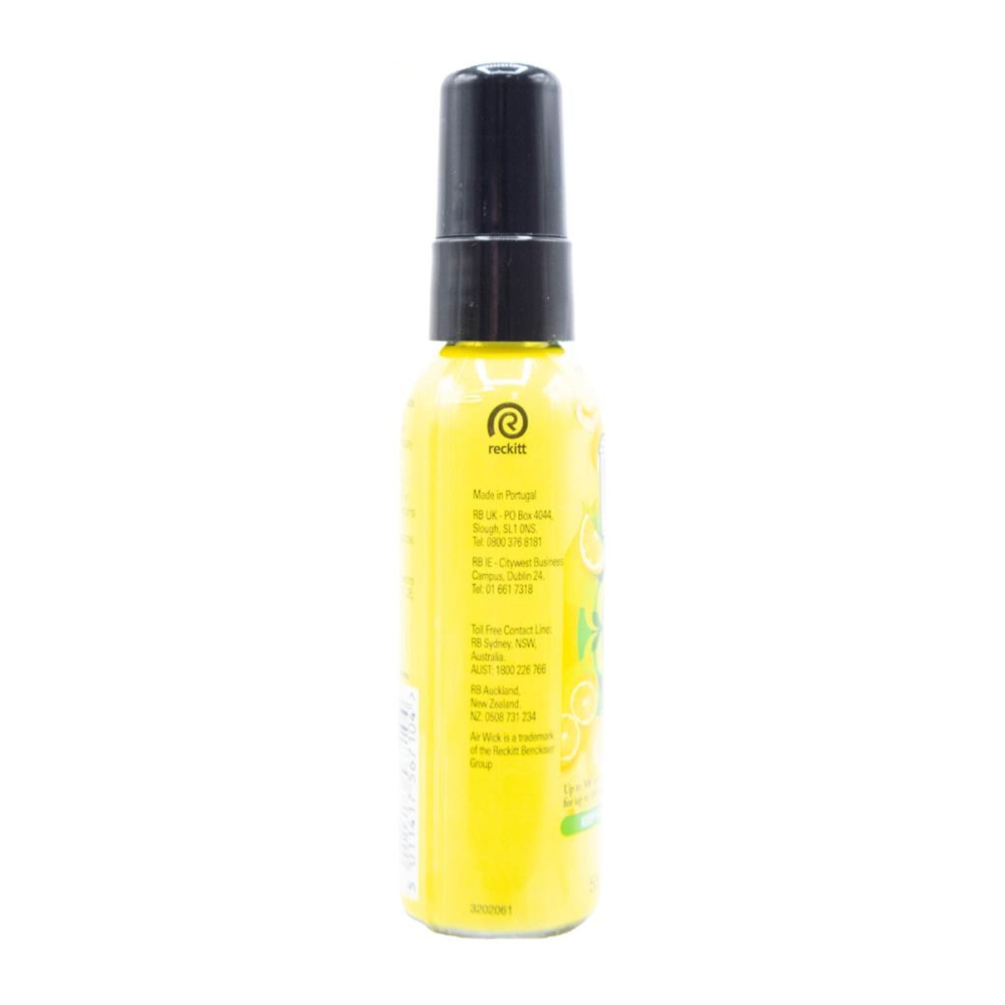 Yellow spray bottle with black cap on a white background