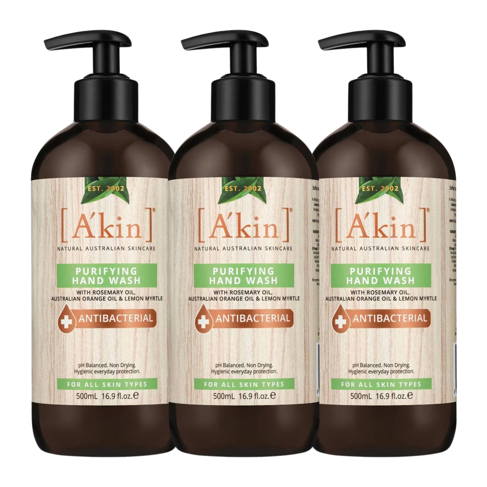 Three bottles of A'kin Purifying Hand Wash on a white background
