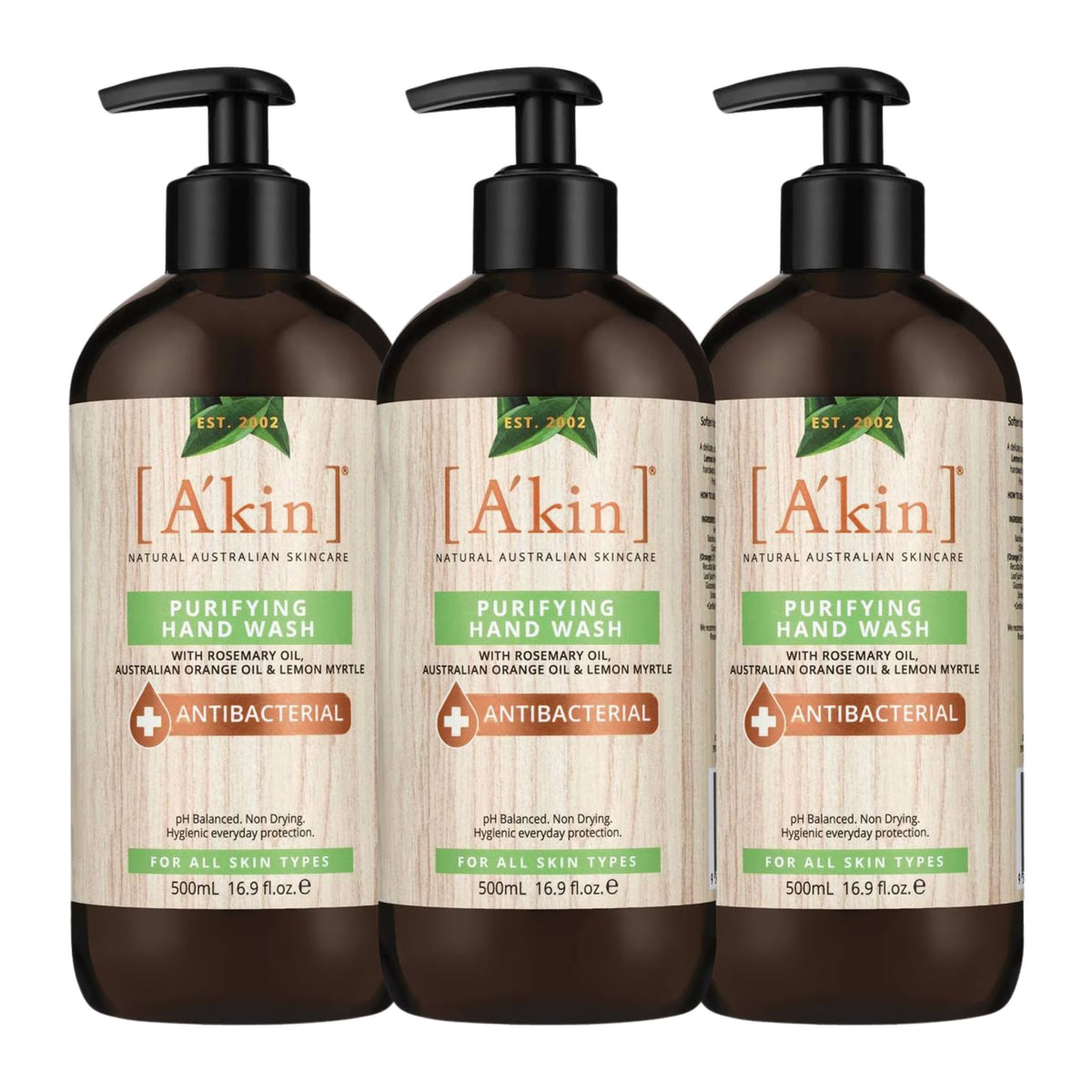 Three bottles of A'kin Purifying Hand Wash on a white background