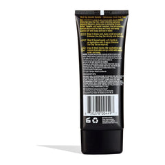 Black cosmetic tube with yellow text on a white background
