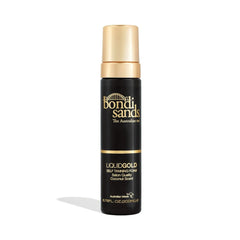 Bondi Sands Liquid Gold Self Tanning Foam in a black bottle with a pump, labeled as hydrating tanning foam with Argan Oil.