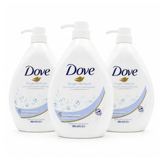 Three white bottles of Dove Pampering Body Wash arranged in a row against a white background, with the center bottle in front and the side bottles slightly behind it.