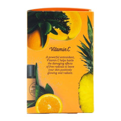 Product packaging with vitamin C text and fruit imagery on an orange background