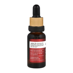 Bottle with dropper and red label on a white background