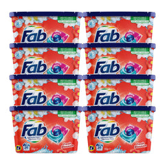 Multiple packs of Fab laundry detergent with colorful packaging on a white background