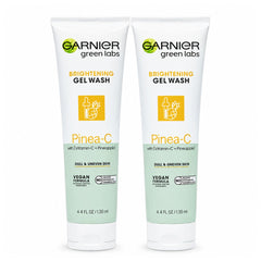 Two bottles of Garnier Green Labs Brightening Gel Wash with Pinea-C on a white background