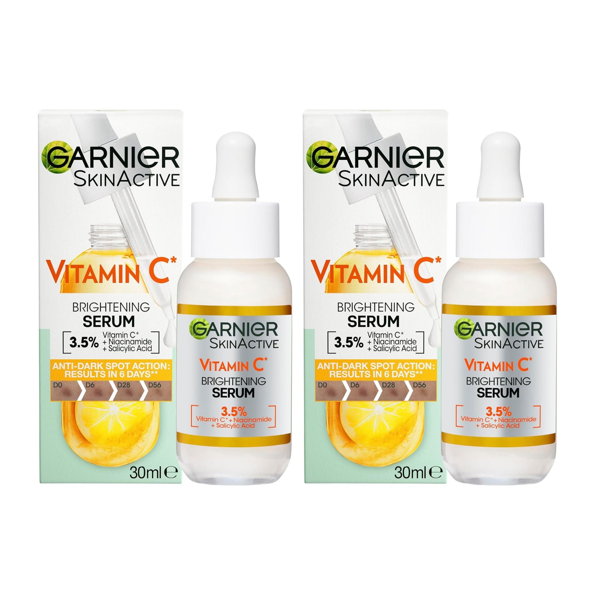 Two bottles and their boxes of Garnier SkinActive Vitamin C Brightening Serum on a white background