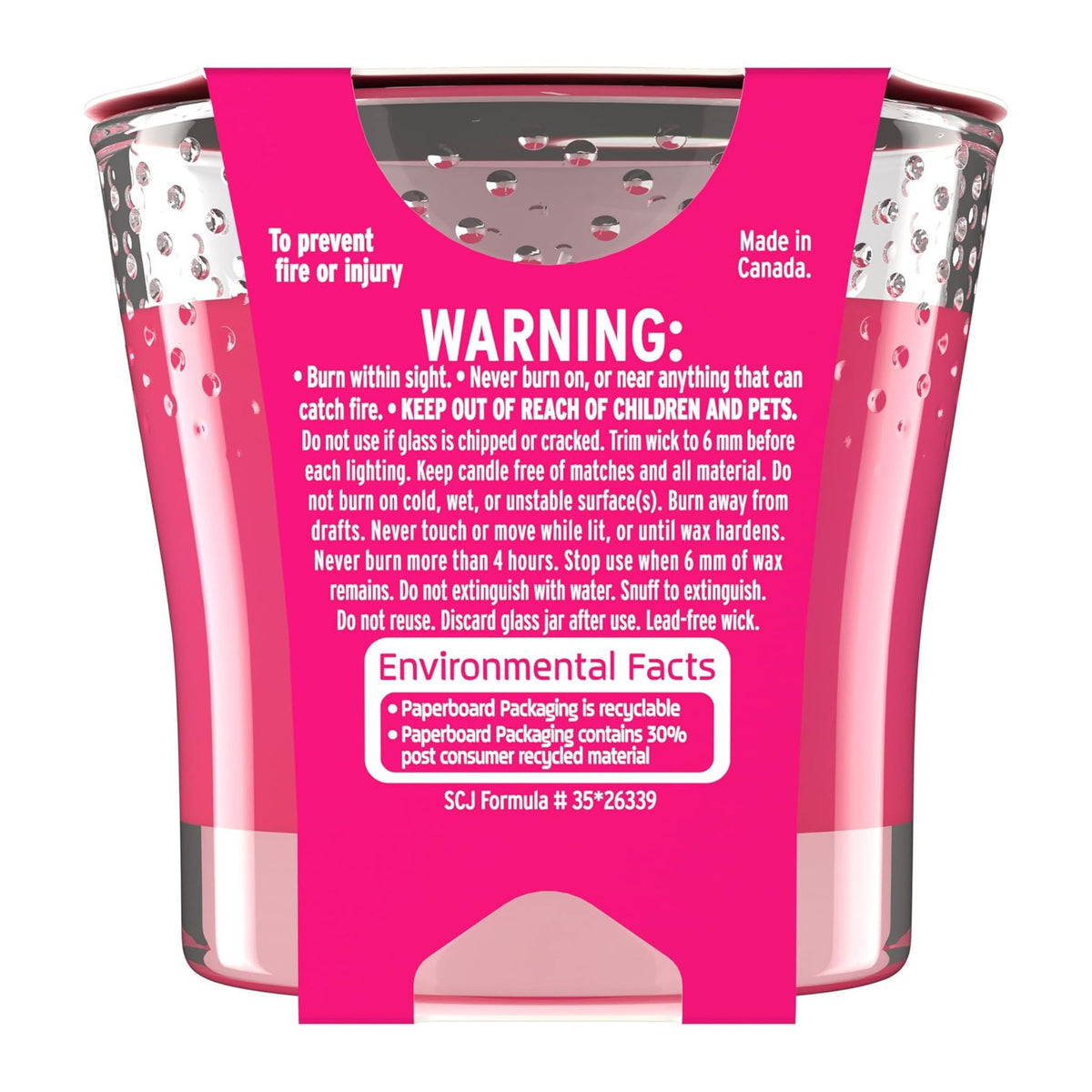 Pink candle jar with warning label and environmental facts on a white background