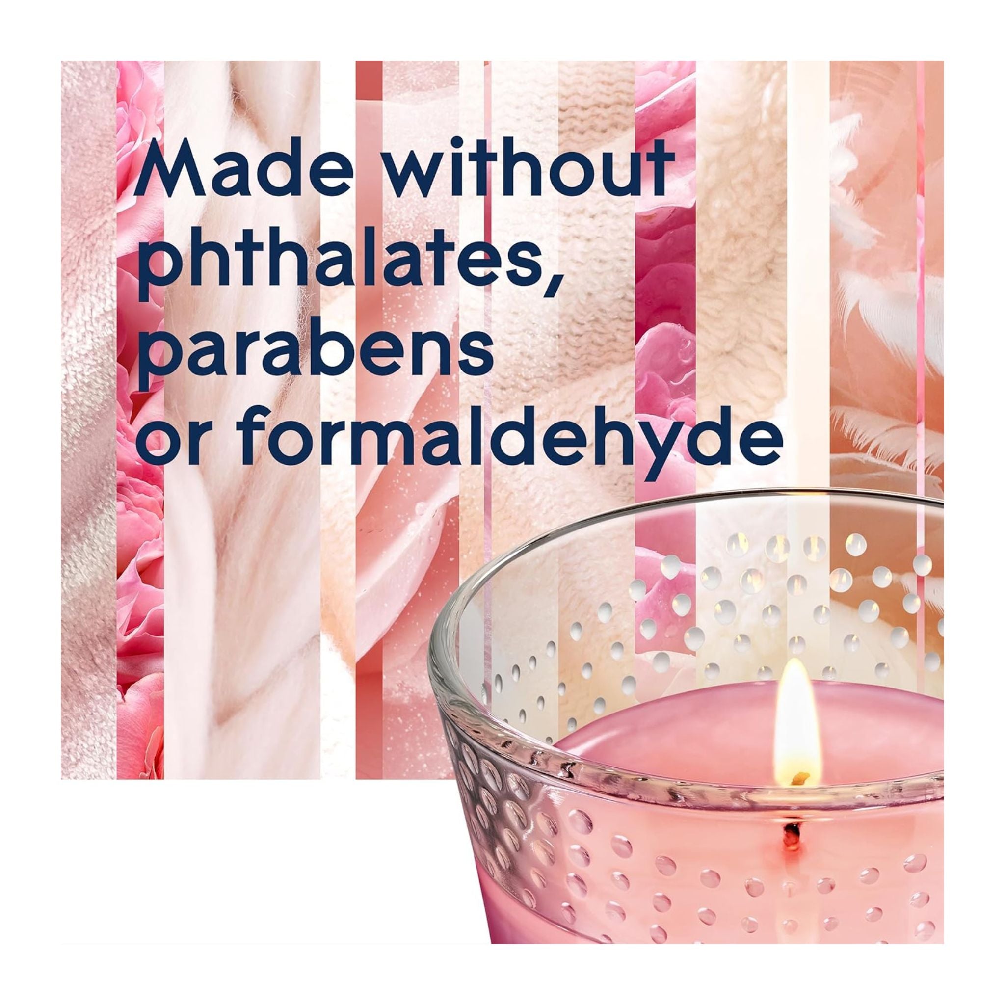 Candle in a glass holder with text about ingredients on a pink floral background